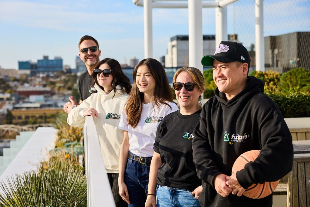 Future Advisory team together on a rooftop terrace